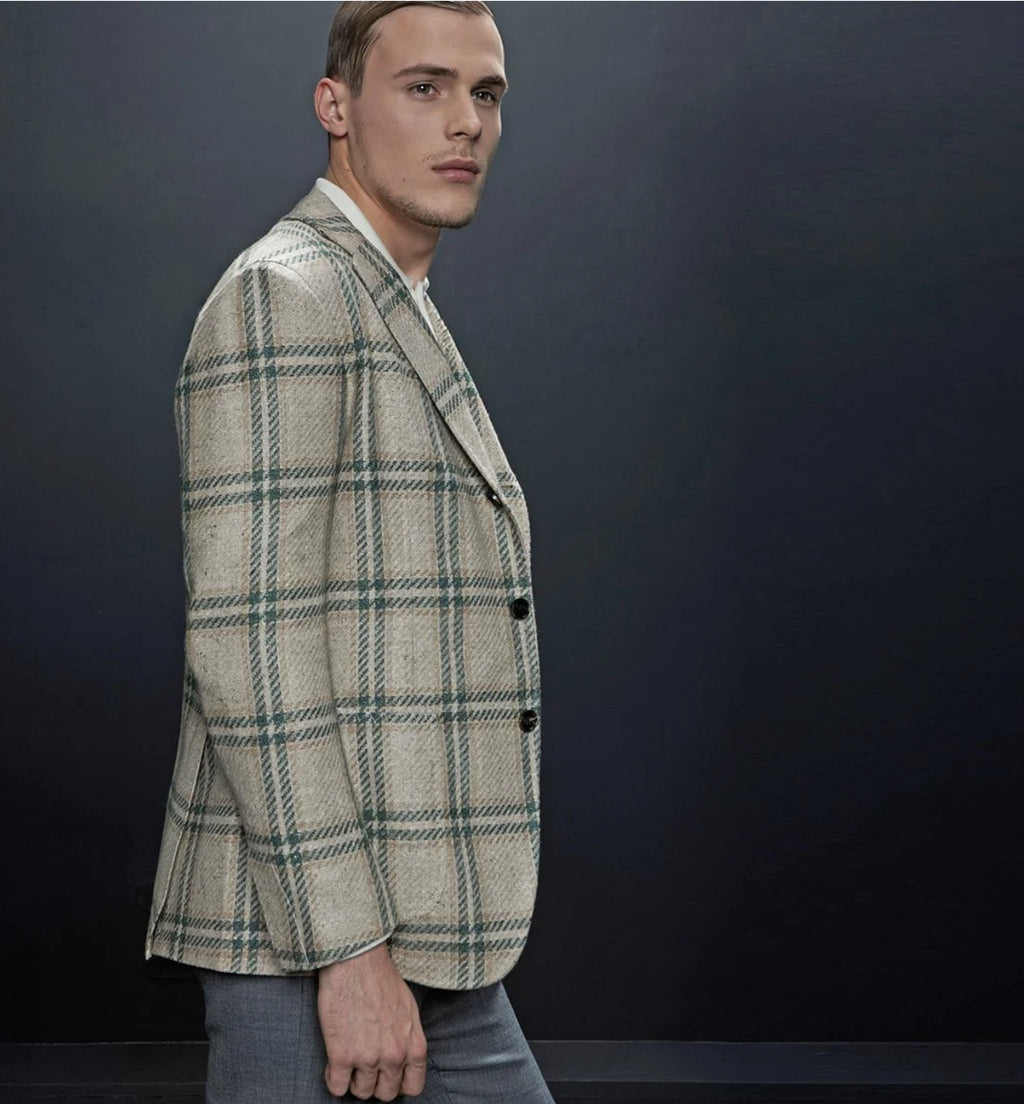 Our mink and emerald windowpane plaid, is made in a wool & silk blend. Fall's favorite colors come to life in this jacket.