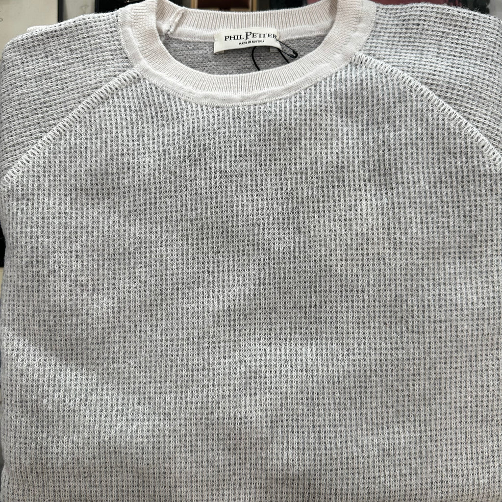 A product of Australia, this soft to the touch an ultra comfortable crewneck sweater features a contrast on the collar, sleeve and bottom along with stitching.