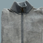 A product of Austria, this full zip cardigan sweater, is made from a fine merino wool blend.