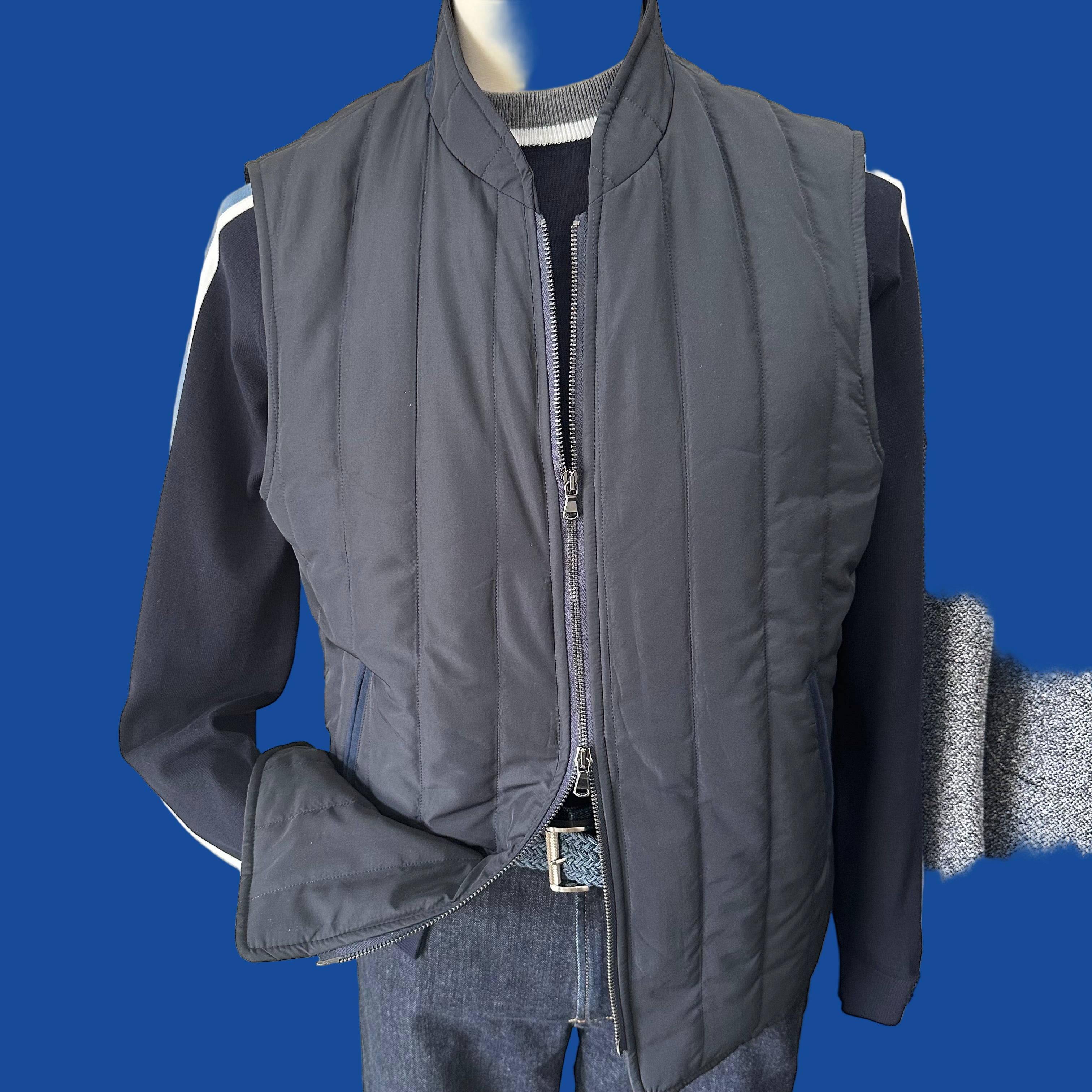 A Fall/Winter wardrobe staple, the light weight quilted vest. Made in Puglia,IT this navy double zip model offers two outside and three interior pockets.