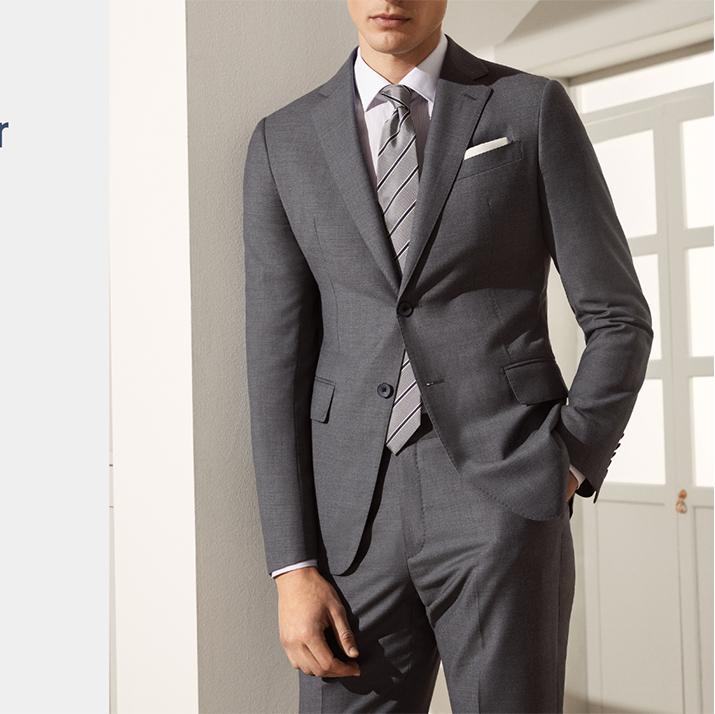 Grey Super 120's wool suit, offered fully lined tailored fit, side vents classic notch lapel.